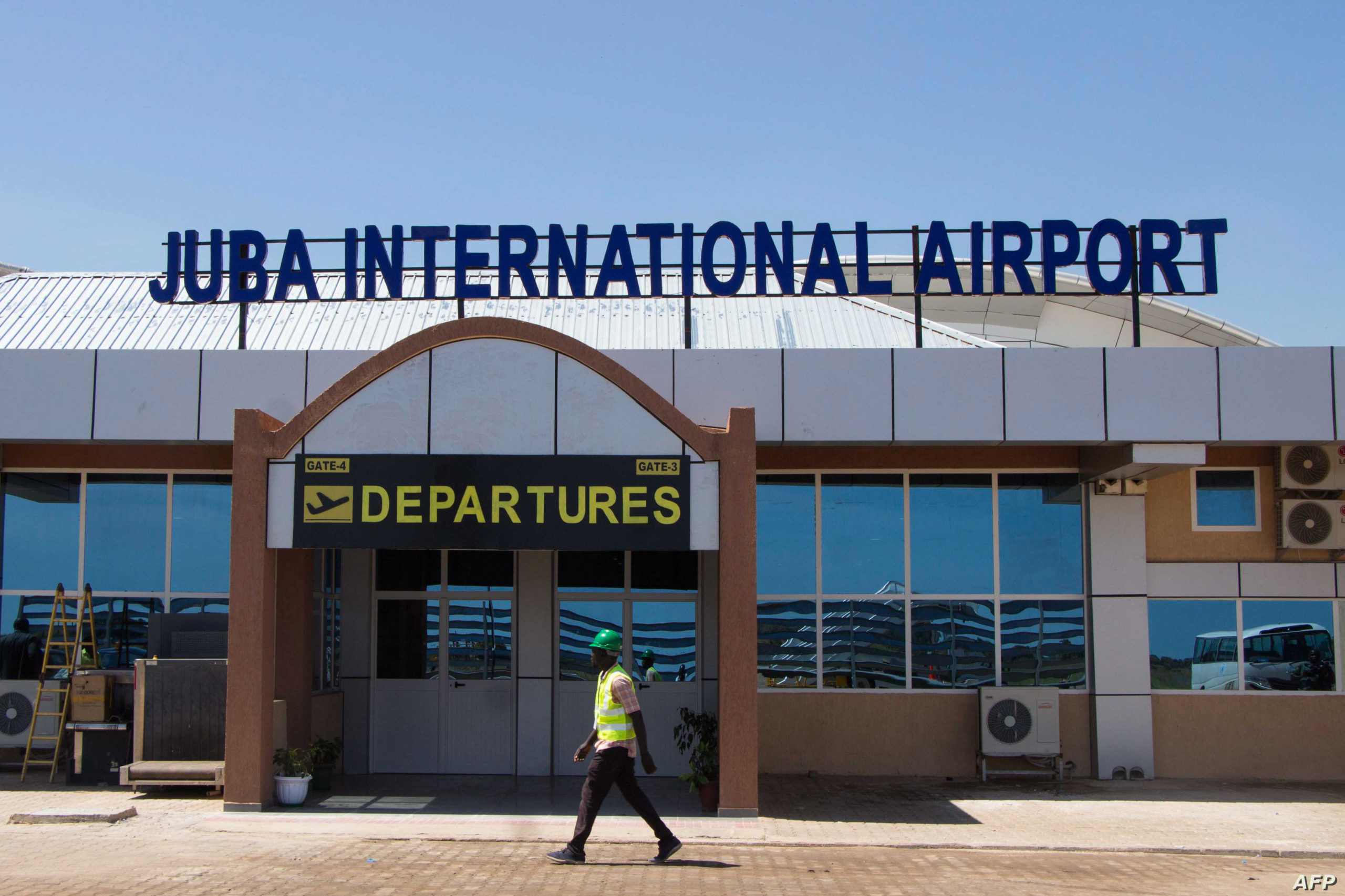 A man walks in front of the departure gate of the new terminal building at Juba International Airport in Juba, South Sudan, on October 29, 2018. - The construction of the new terminal at the country's main international airport was part of a move by the government to upgrade the airport, according to media reports. Construction was slow because of the economical and political situation in the country. (Photo by Akuot Chol / AFP)